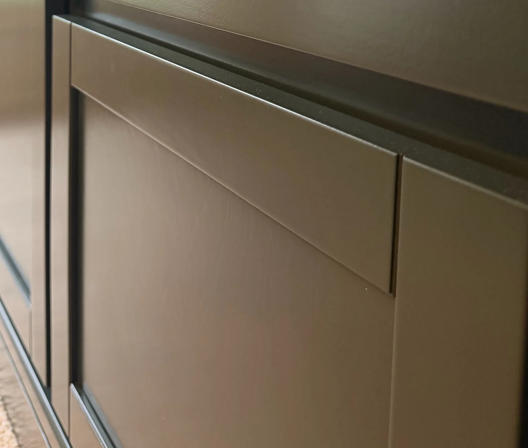 Close-up showing the subtle custom-milled profile on a finished shaker front