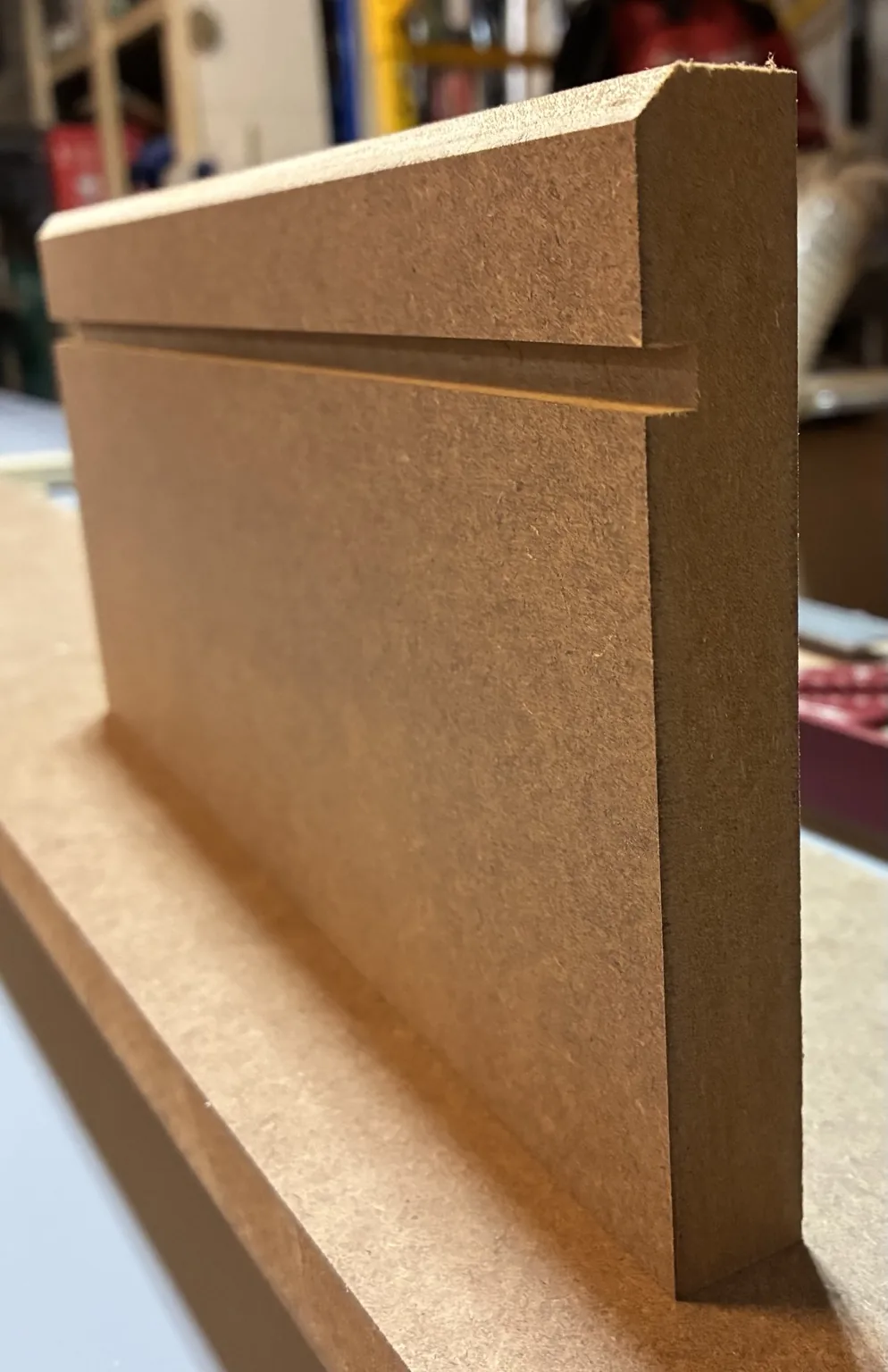 Custom-milled base molding profile sample created for the project
